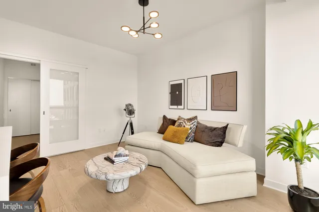 a bedroom with a bed and chandelier