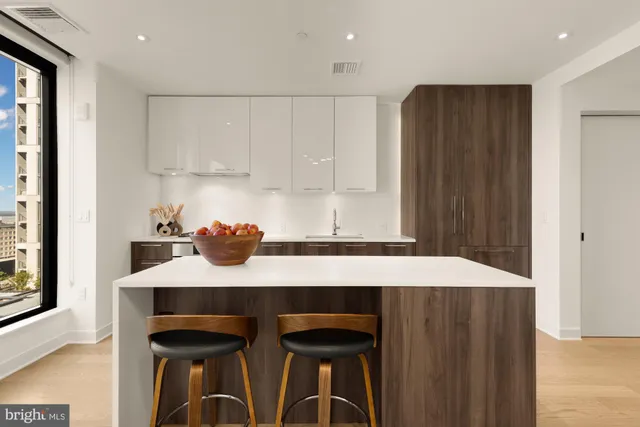 a kitchen with granite countertop a sink cabinets and window