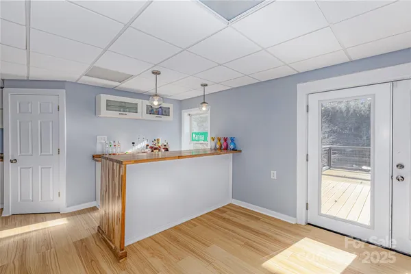 a view of kitchen with a refrigerator cabinets and a sink