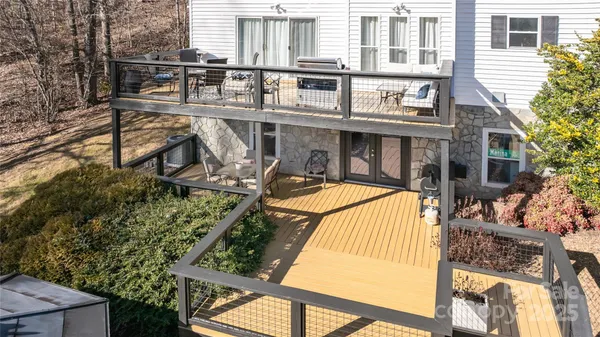 an aerial view of a house with a lake view