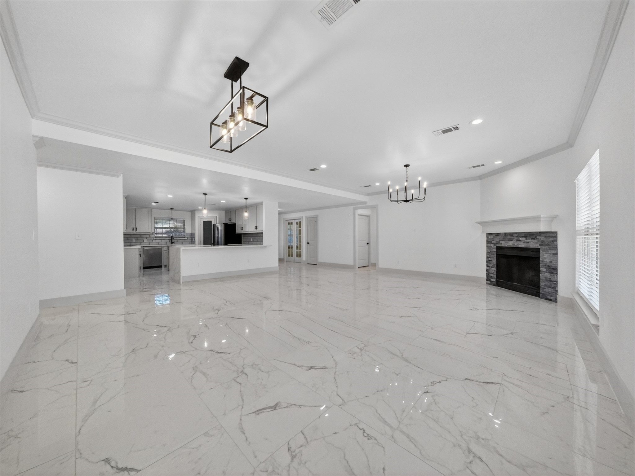 19502 Balsas Drive Porter, TX 77365 - Photo 12 of 44 From weekday dinners to weekend gatherings, this flexible space adapts to it all, with seamless flow from the dining table to the fireplace.