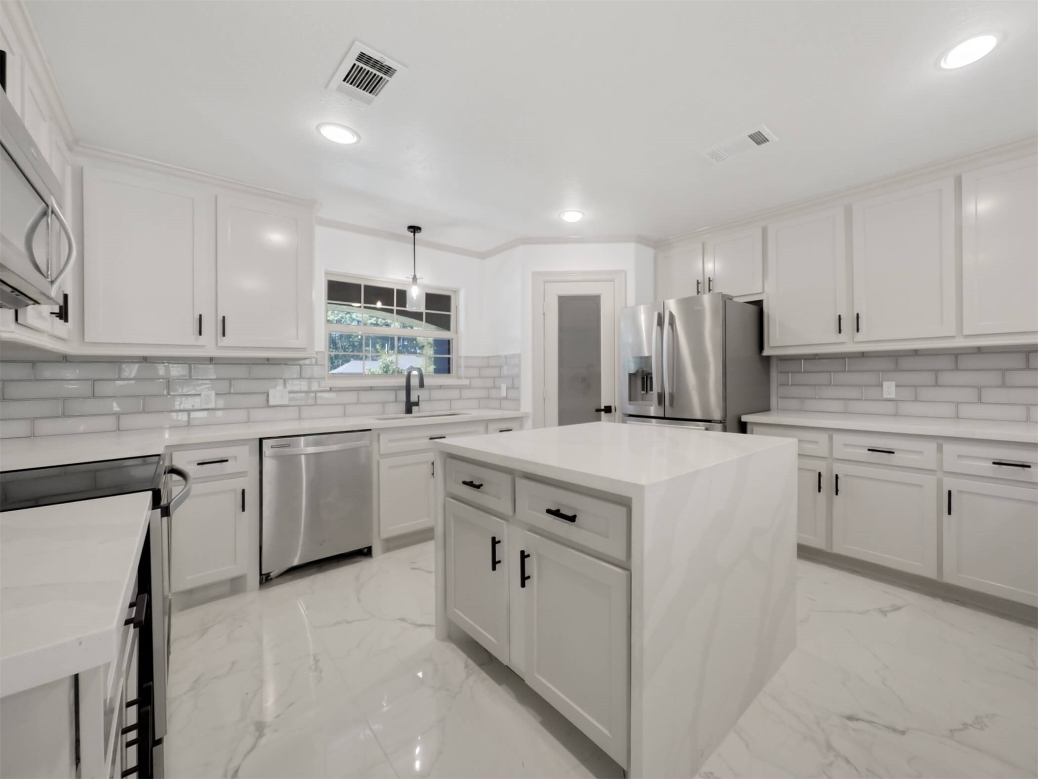 19502 Balsas Drive Porter, TX 77365 - Photo 15 of 44 Whether it’s morning coffee, midnight leftovers, or hosting a full spread, this kitchen handles it all with quartz counters, tons of cabinet space, and bar seating that keeps everyone connected.