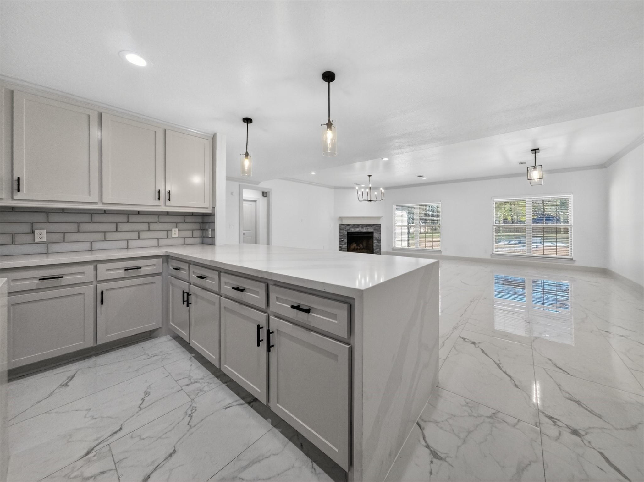 19502 Balsas Drive Porter, TX 77365 - Photo 19 of 44 Whether it’s morning coffee, midnight leftovers, or hosting a full spread, this kitchen handles it all with quartz counters, tons of cabinet space, and bar seating that keeps everyone connected.