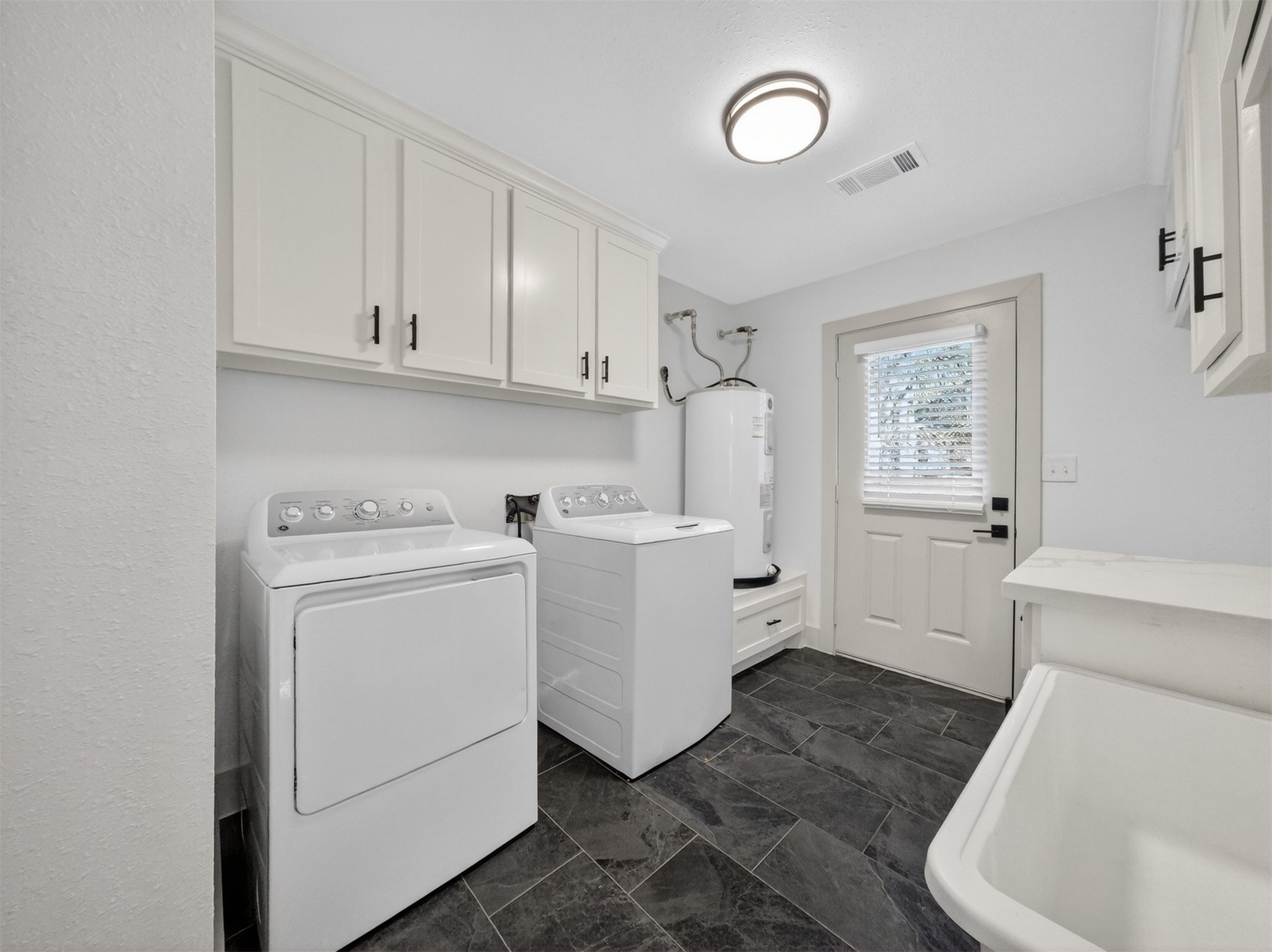 19502 Balsas Drive Porter, TX 77365 - Photo 34 of 44 Laundry room. Side door exterior access.