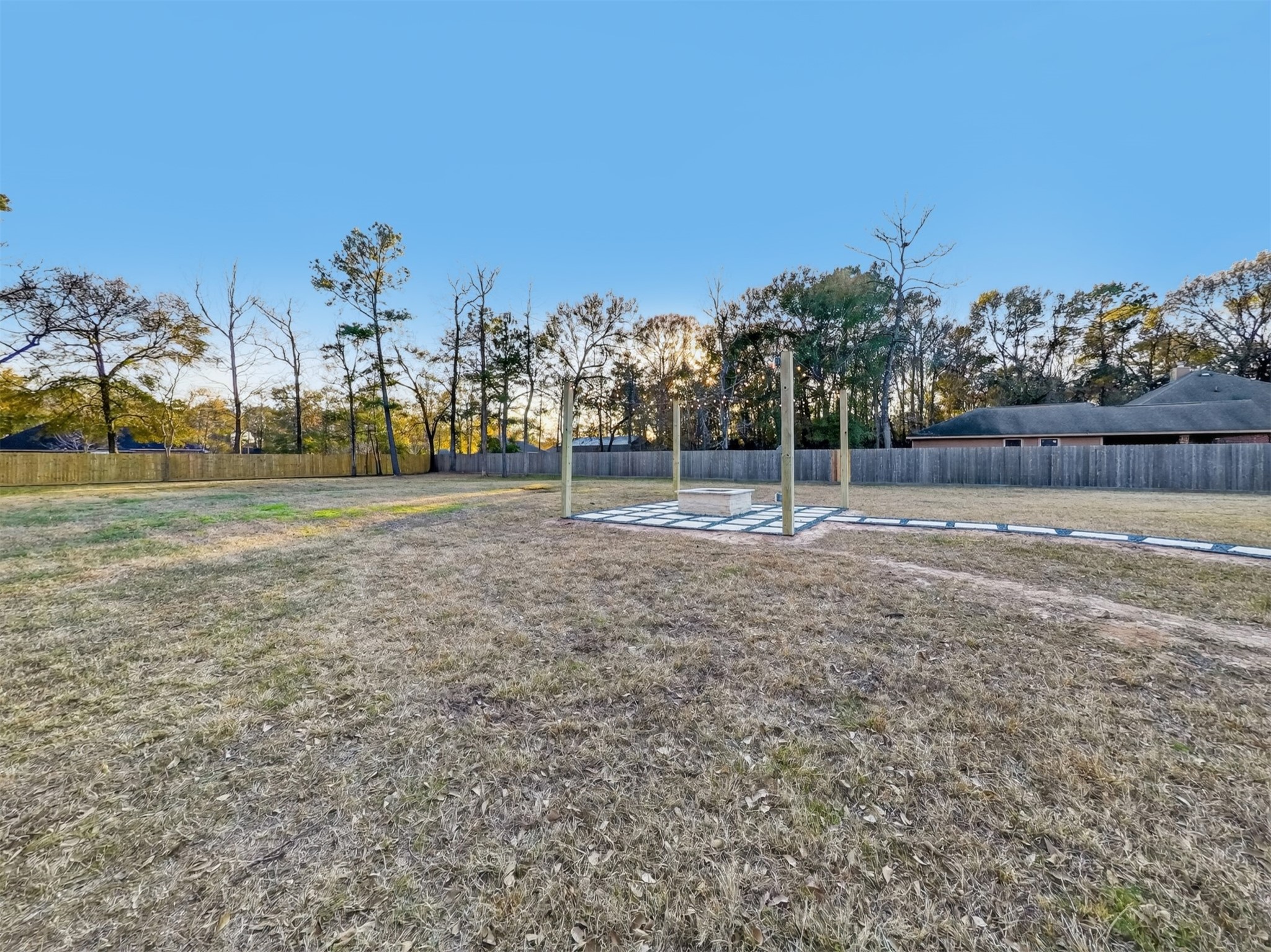 19502 Balsas Drive Porter, TX 77365 - Photo 38 of 44 Cozy nights under the stars start here—gather ‘round the firepit and let the day fade away.