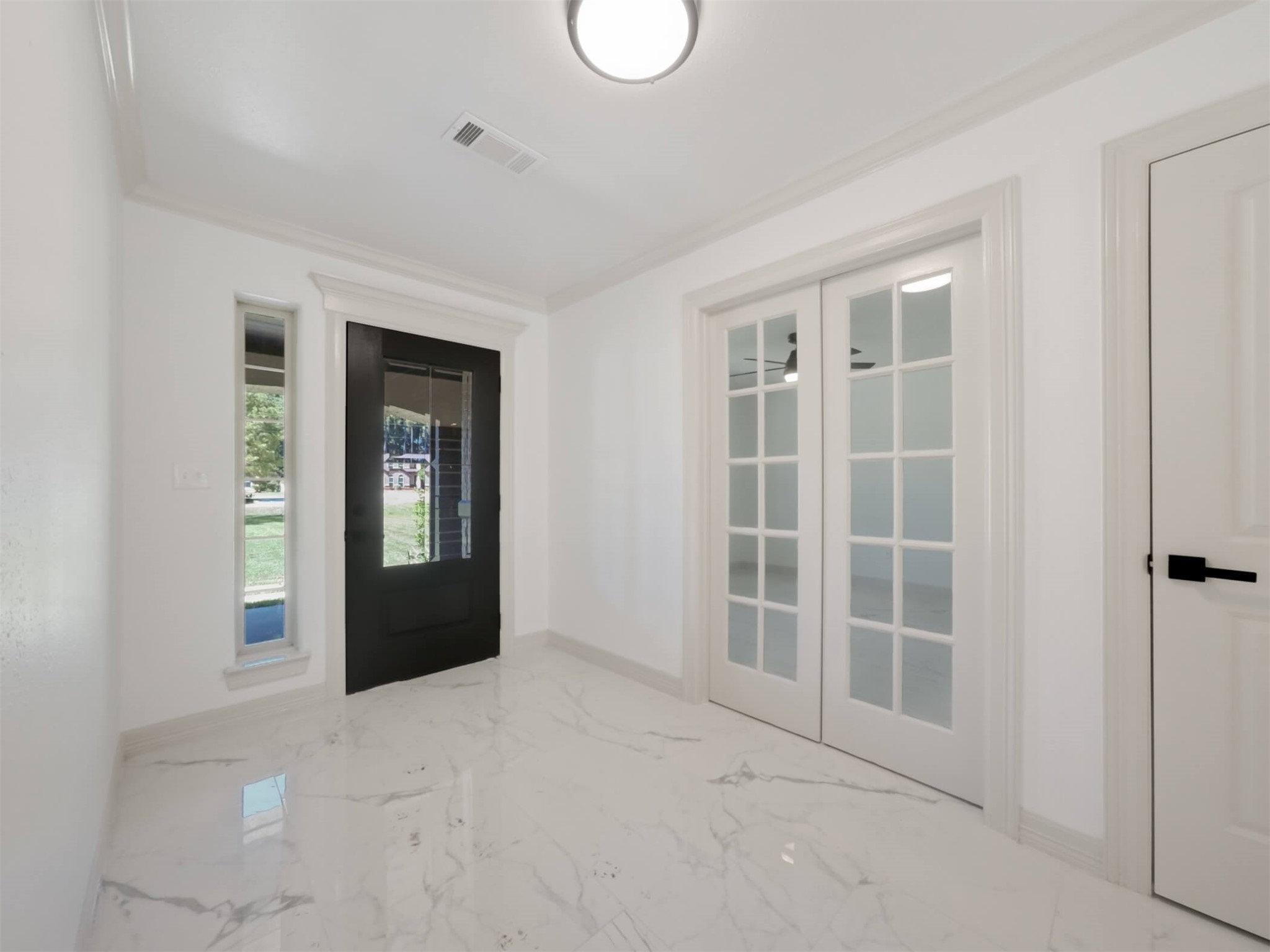 19502 Balsas Drive Porter, TX 77365 - Photo 5 of 44 First impressions matter, and this entry delivers with stylish tile flooring, crown molding, and a tucked-away home office for serious productivity (or peace and quiet).