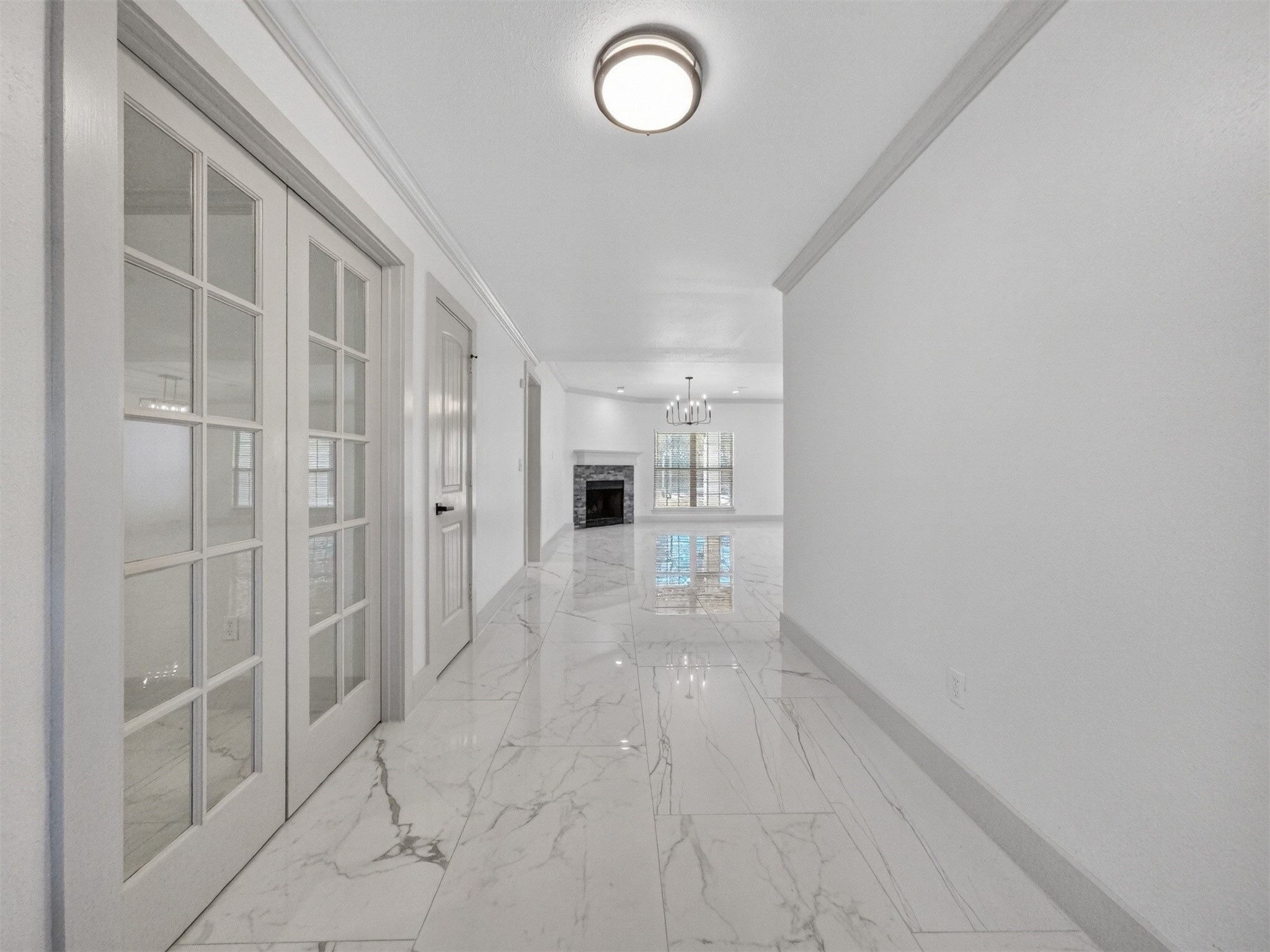 19502 Balsas Drive Porter, TX 77365 - Photo 8 of 44 As you walk in, you're greeted with a wide hallway and a quiet, private office right off the entry—ideal for focused work, studying, or running your empire from home.