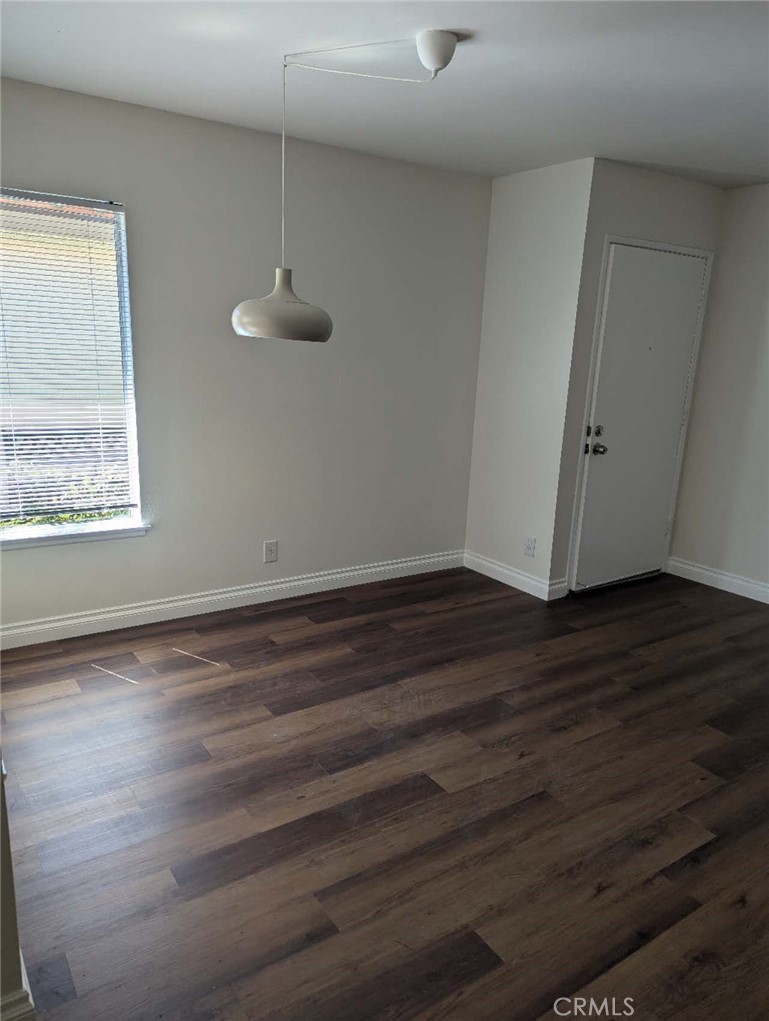 64 Tangerine Irvine, CA 92618 - Photo 12 of 32 a view of a room with wooden floor staircase and a ceiling fan