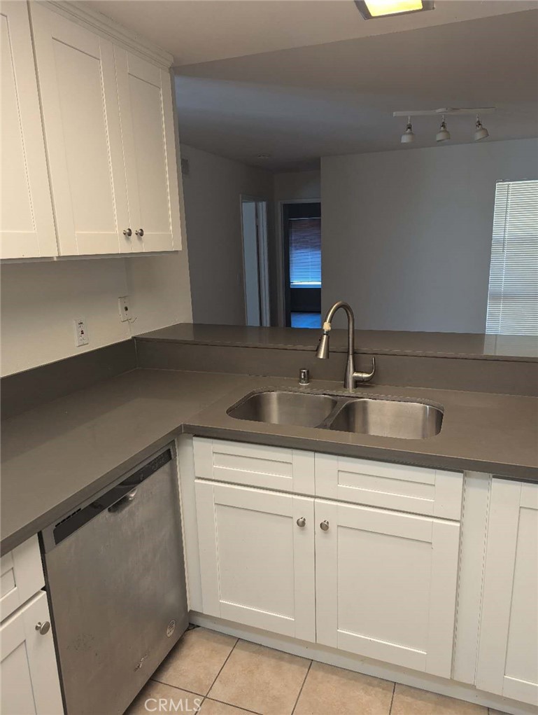 64 Tangerine Irvine, CA 92618 - Photo 14 of 32 a kitchen with white cabinets