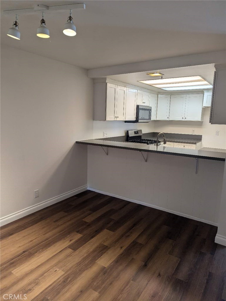 64 Tangerine Irvine, CA 92618 - Photo 15 of 32 a kitchen with a sink a stove and cabinets