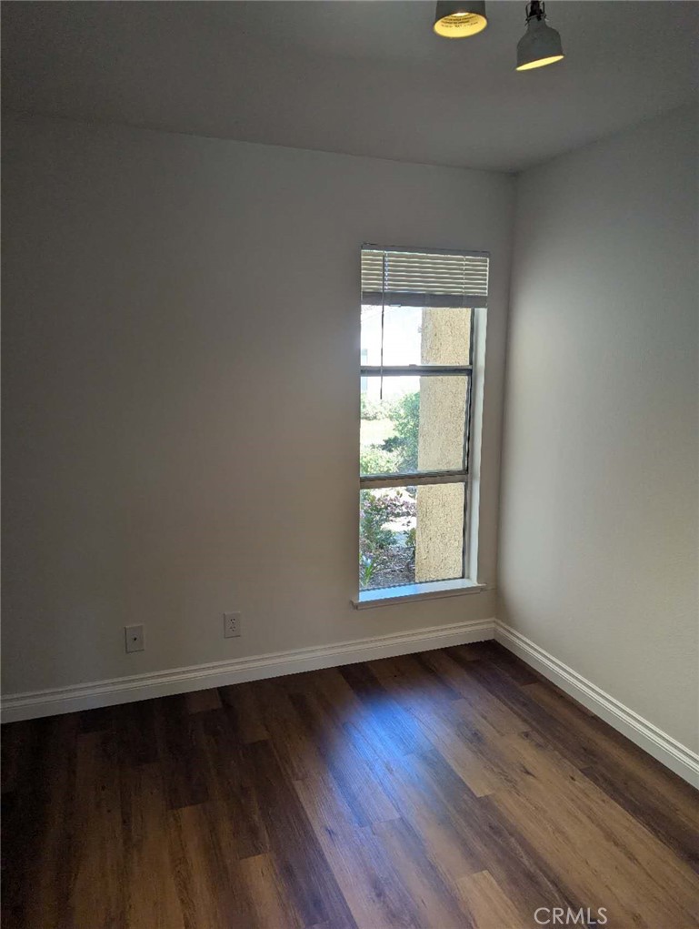 64 Tangerine Irvine, CA 92618 - Photo 17 of 32 an empty room with wooden floor and windows