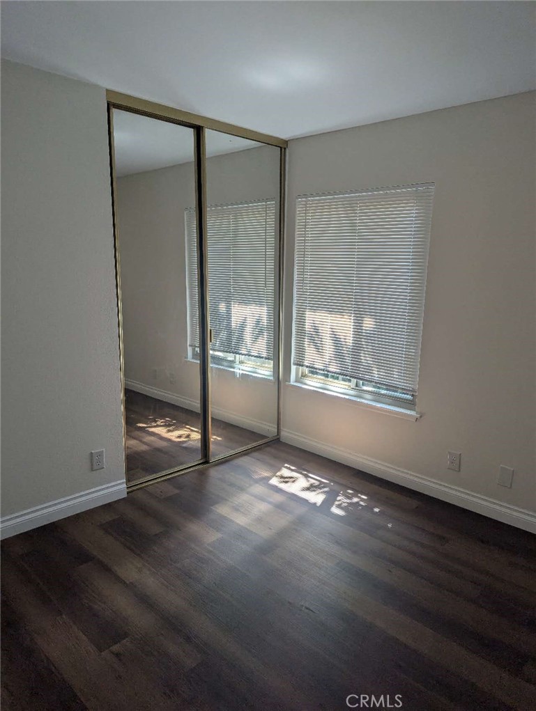 64 Tangerine Irvine, CA 92618 - Photo 18 of 32 an empty room with wooden floor and windows