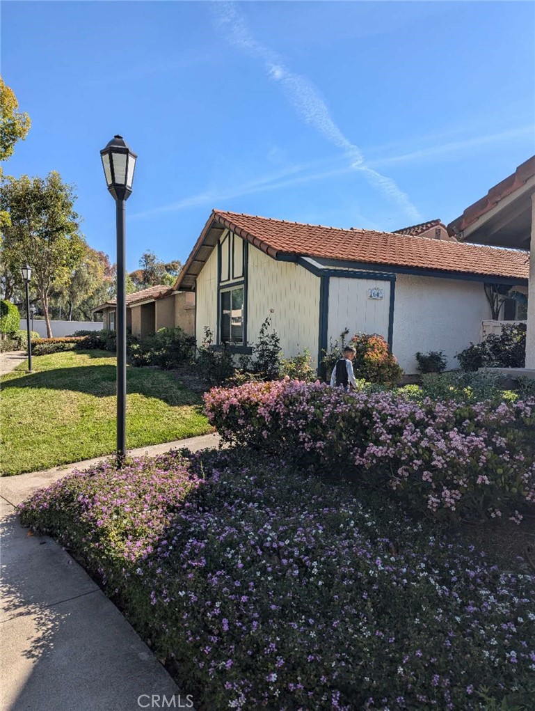 64 Tangerine Irvine, CA 92618 - Photo 2 of 32 a house view with a garden space