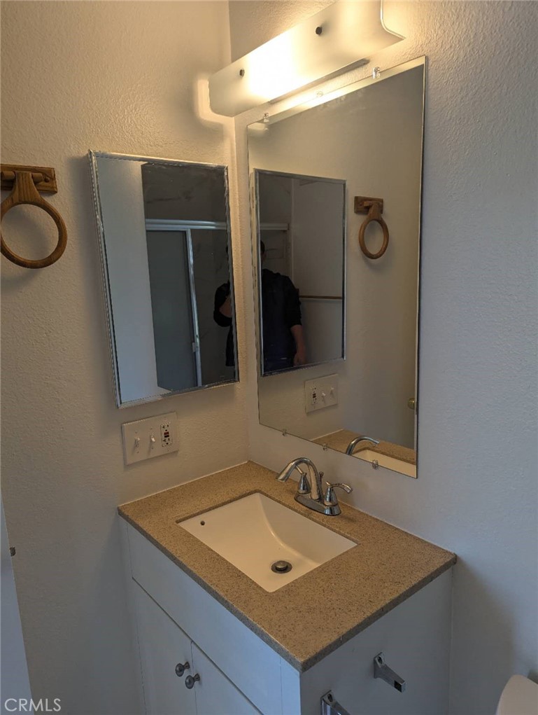 64 Tangerine Irvine, CA 92618 - Photo 23 of 32 a bathroom with a sink and a mirror