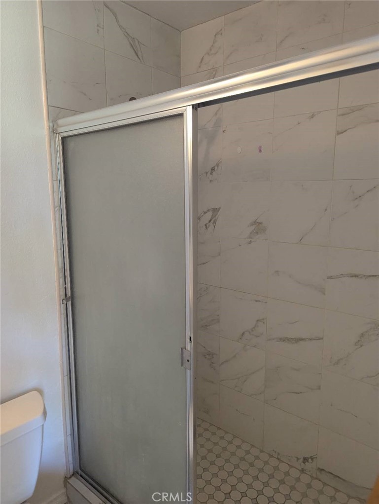 64 Tangerine Irvine, CA 92618 - Photo 24 of 32 a bathroom with a shower and a toilet