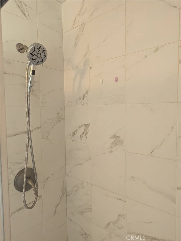 64 Tangerine Irvine, CA 92618 - Photo 25 of 32 a bathroom with a shower