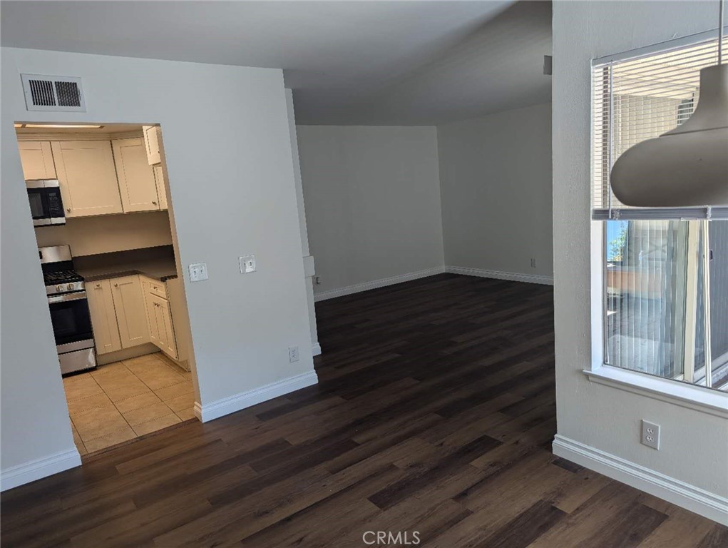 64 Tangerine Irvine, CA 92618 - Photo 8 of 32 a view of entryway and hall with wooden floor