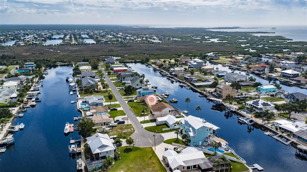 4181 Diaz Court Hernando Beach, FL 34607 - Photo 6 of 12 an aerial view of residential houses with outdoor space