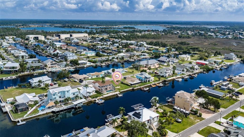 4181 Diaz Court Hernando Beach, FL 34607 - Photo 7 of 12 an aerial view of lake and residential houses with outdoor space