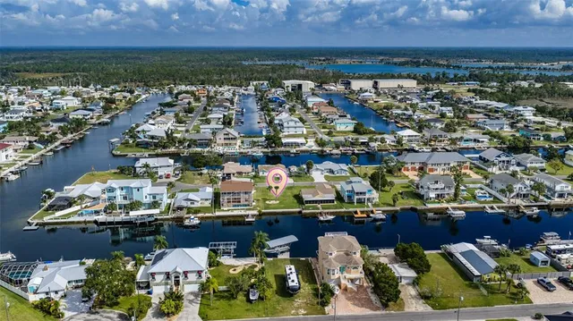 an aerial view of a house with a lake view