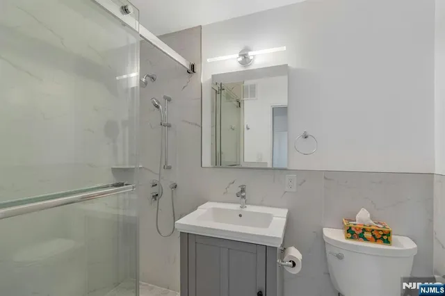 a bathroom with a sink toilet and vanity