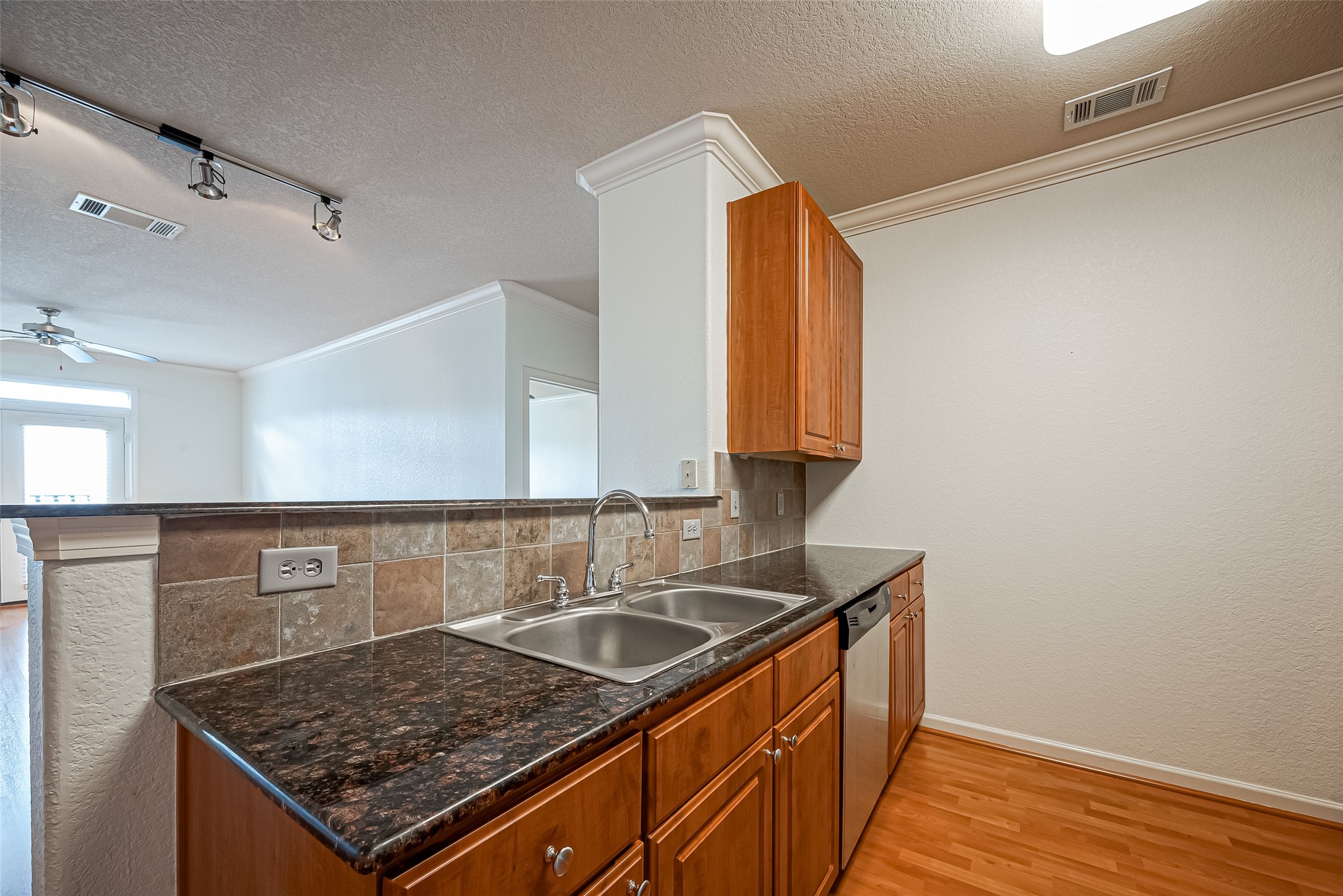 1711 Old Spanish Trail, Unit 303 Houston, TX 77054 - Photo 11 of 37 a kitchen with sink stove and cabinets