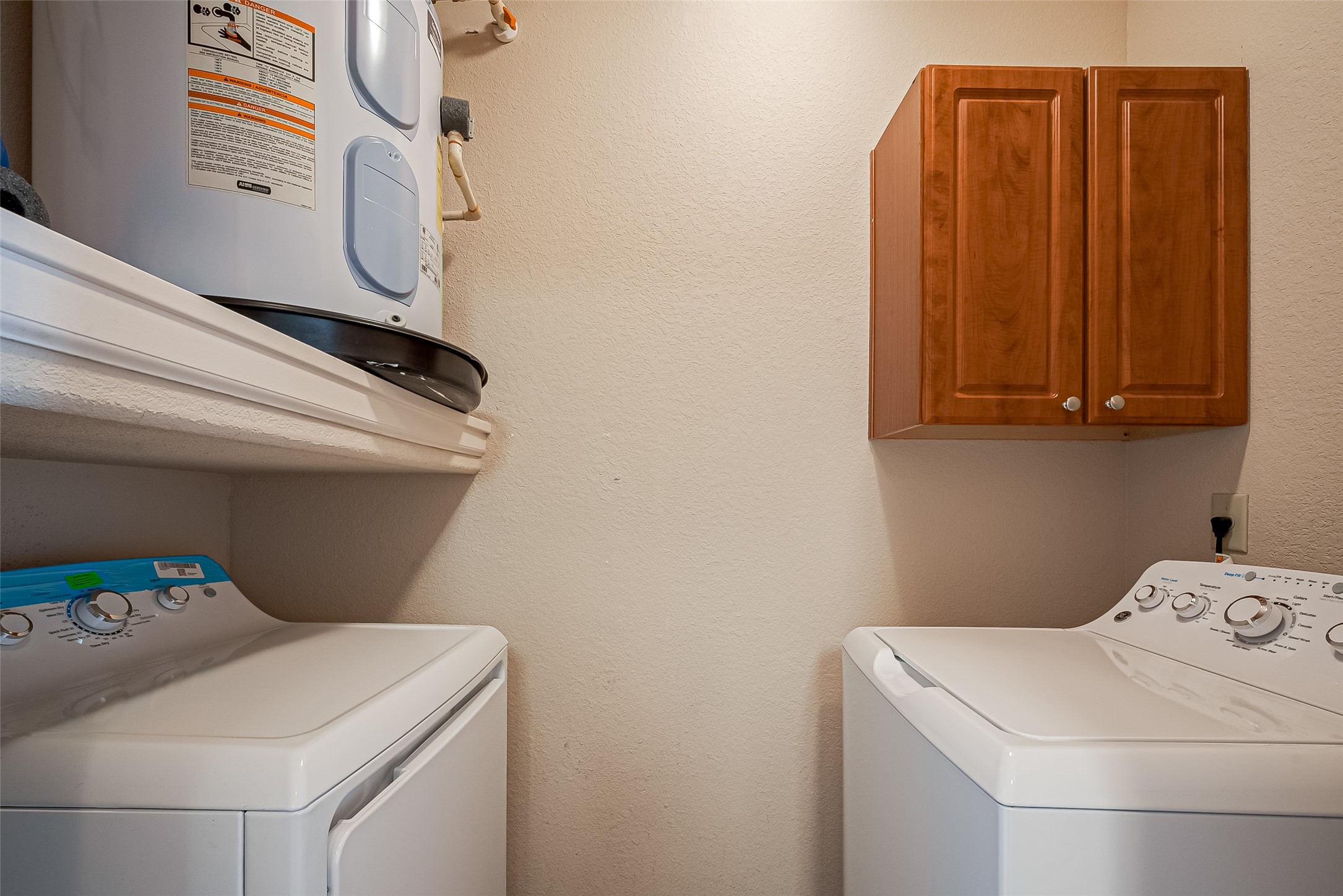 1711 Old Spanish Trail, Unit 303 Houston, TX 77054 - Photo 15 of 37 a utility room with dryer and washer