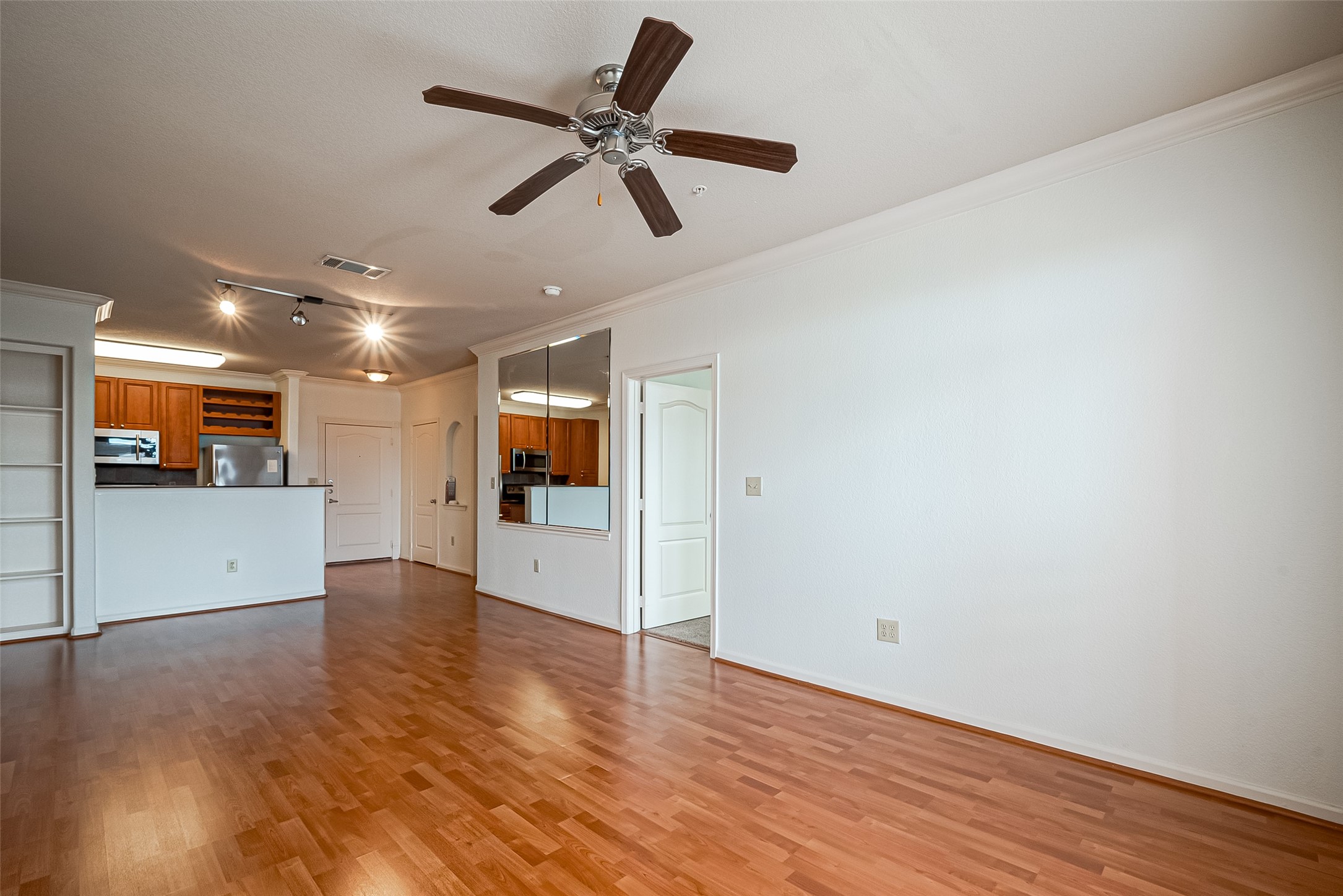 1711 Old Spanish Trail, Unit 303 Houston, TX 77054 - Photo 37 of 37 a view of a big room with wooden floor and windows