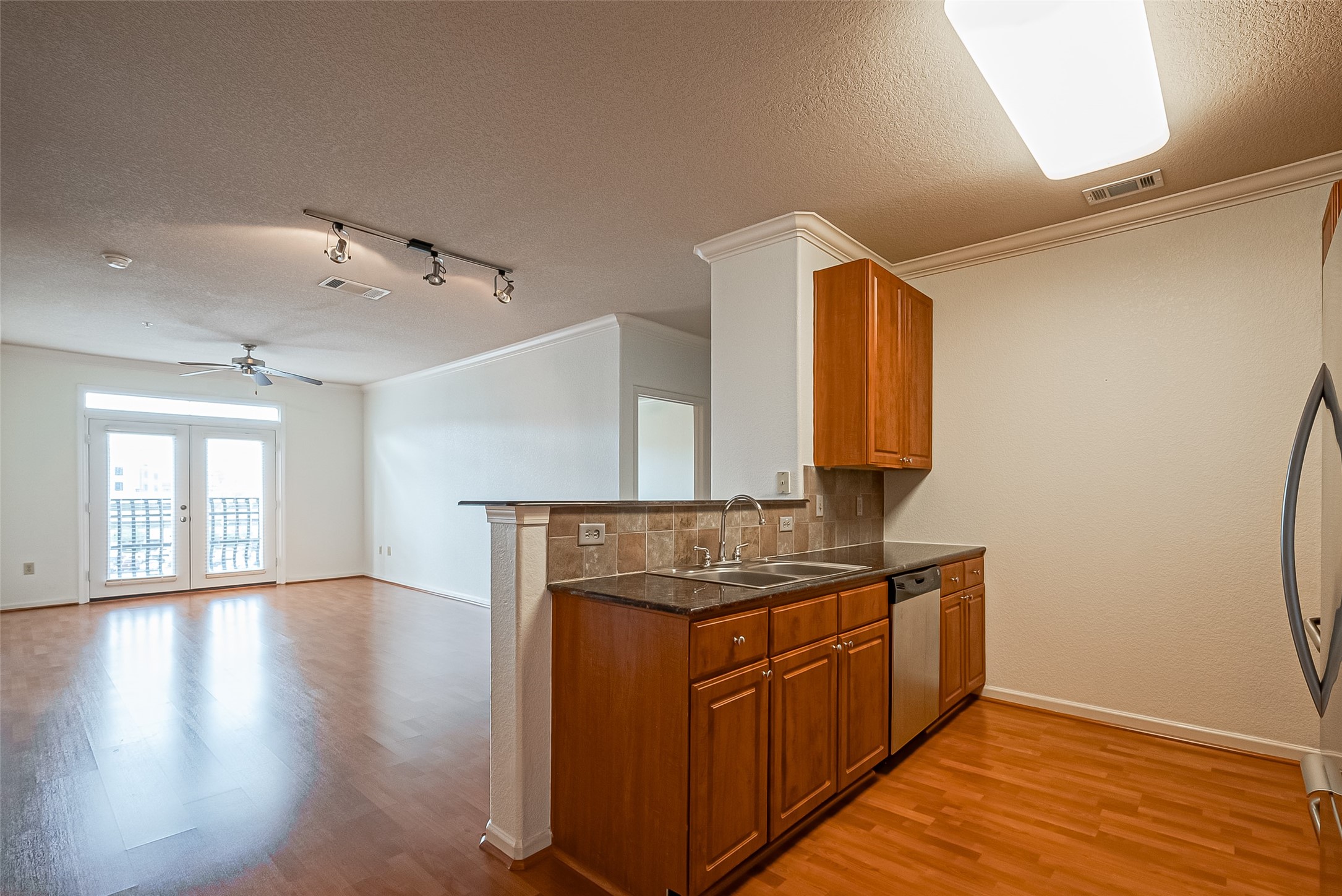 1711 Old Spanish Trail, Unit 303 Houston, TX 77054 - Photo 8 of 37 a kitchen with stainless steel appliances granite countertop a sink stove and cabinets