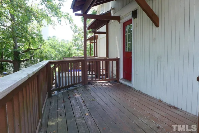 a view of porch with wooden floor