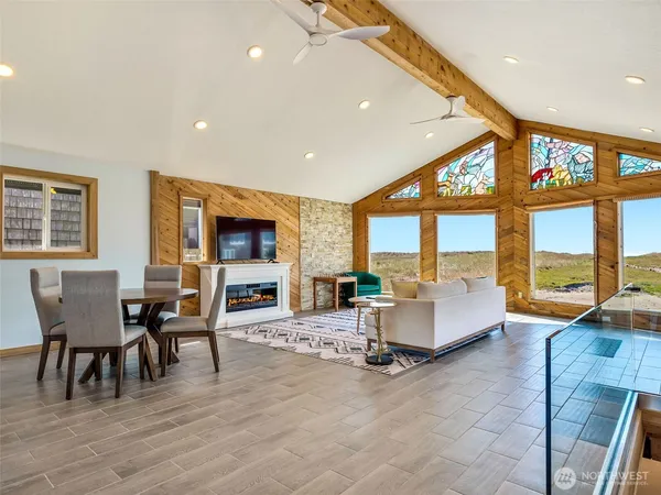 a living room with a fireplace and a flat screen tv