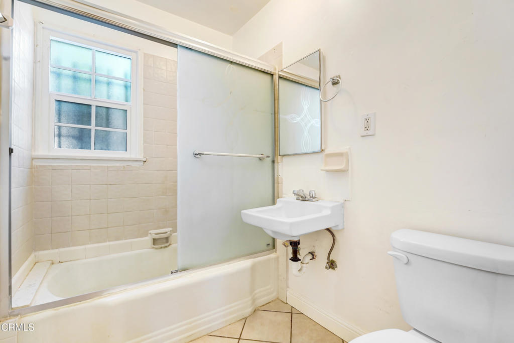 4824 Toland Way Los Angeles, CA 90041 - Photo 12 of 26 a bathroom with a sink a toilet and shower