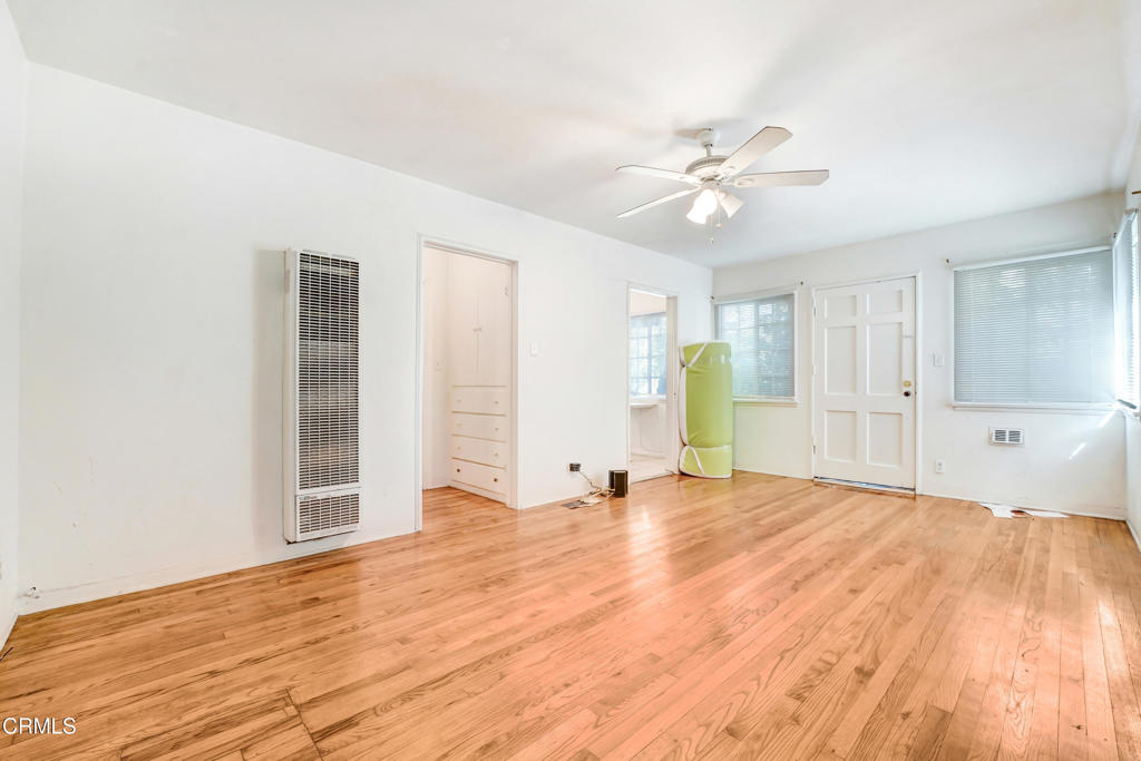 4824 Toland Way Los Angeles, CA 90041 - Photo 3 of 26 a view of an empty room with chandelier fan and a window