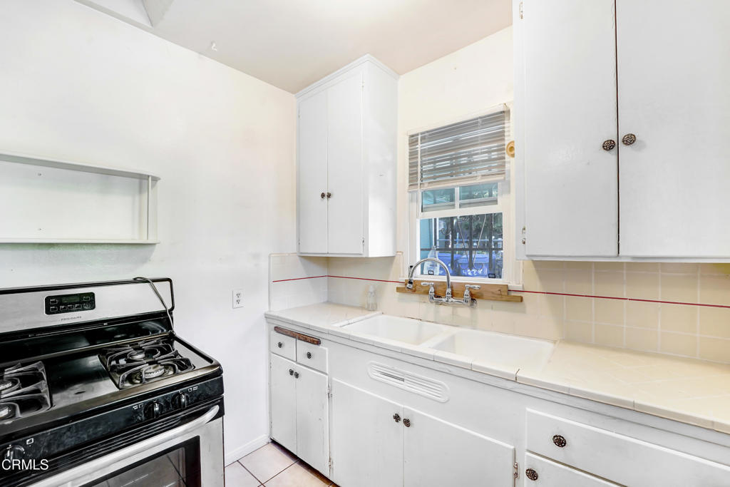 4824 Toland Way Los Angeles, CA 90041 - Photo 4 of 26 a kitchen with a stove and a sink