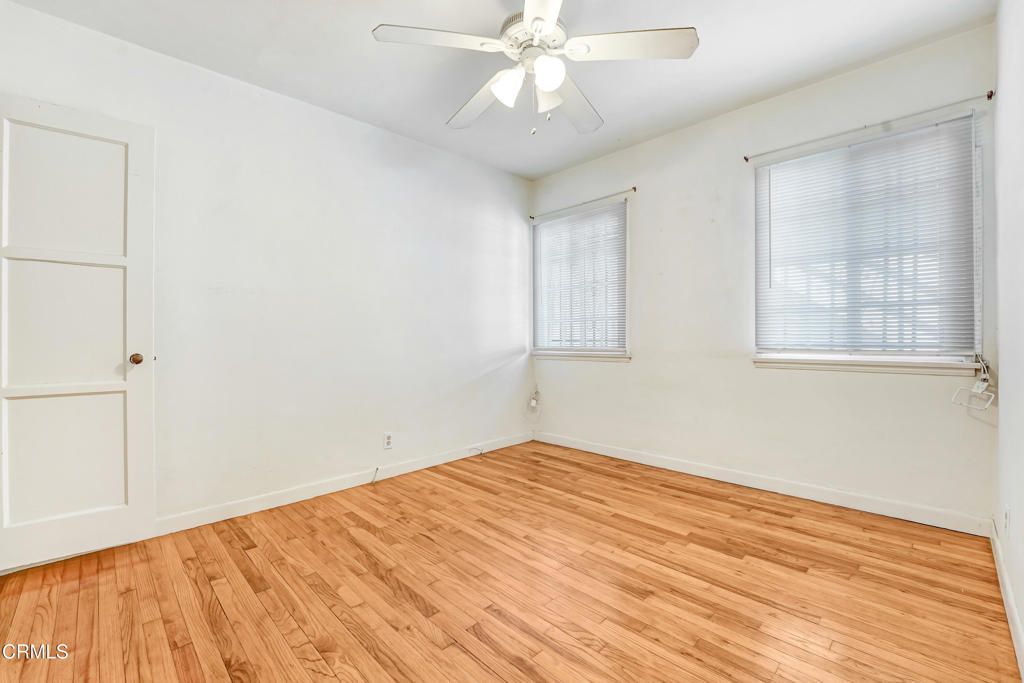4824 Toland Way Los Angeles, CA 90041 - Photo 10 of 26 a view of empty room with wooden floor and fan