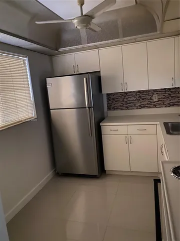 a view of a kitchen with electric appliances