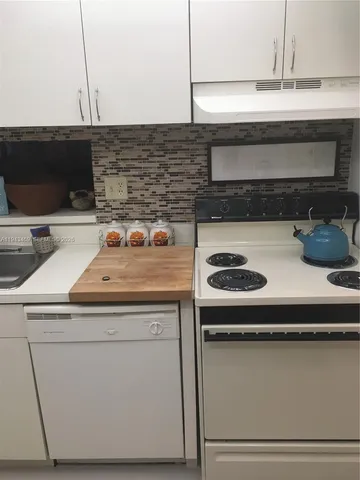 a view of a room with a refrigerator