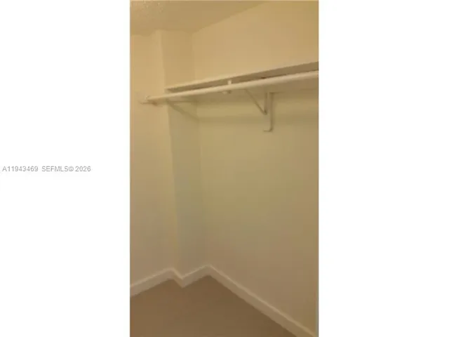 a view of balcony with wooden floor