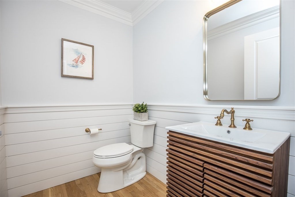 6 Rolleston Road Marblehead, MA 01945 - Photo 11 of 26 a bathroom with a sink a toilet and a mirror
