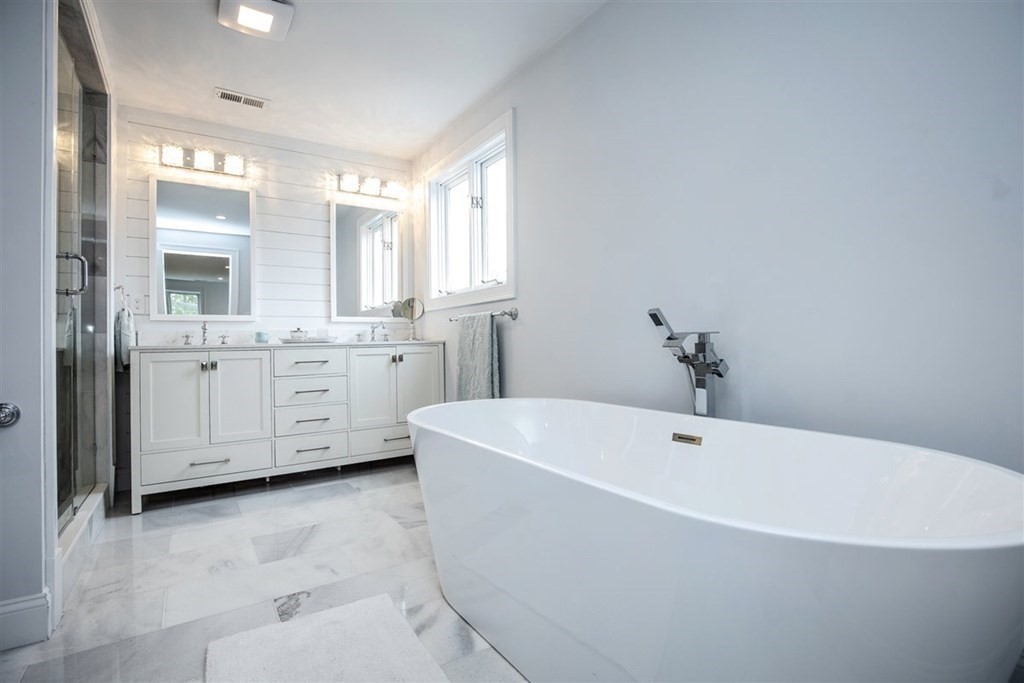 6 Rolleston Road Marblehead, MA 01945 - Photo 14 of 26 a white bath tub sitting in a spacious bathroom