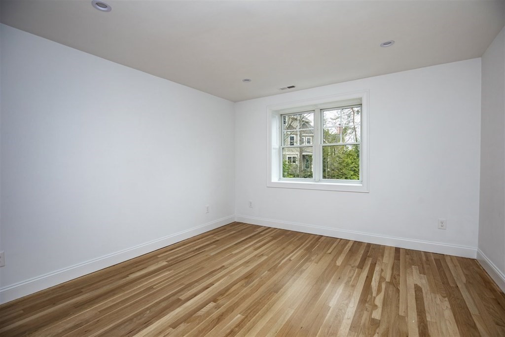 6 Rolleston Road Marblehead, MA 01945 - Photo 20 of 26 wooden floor in an empty room with a window