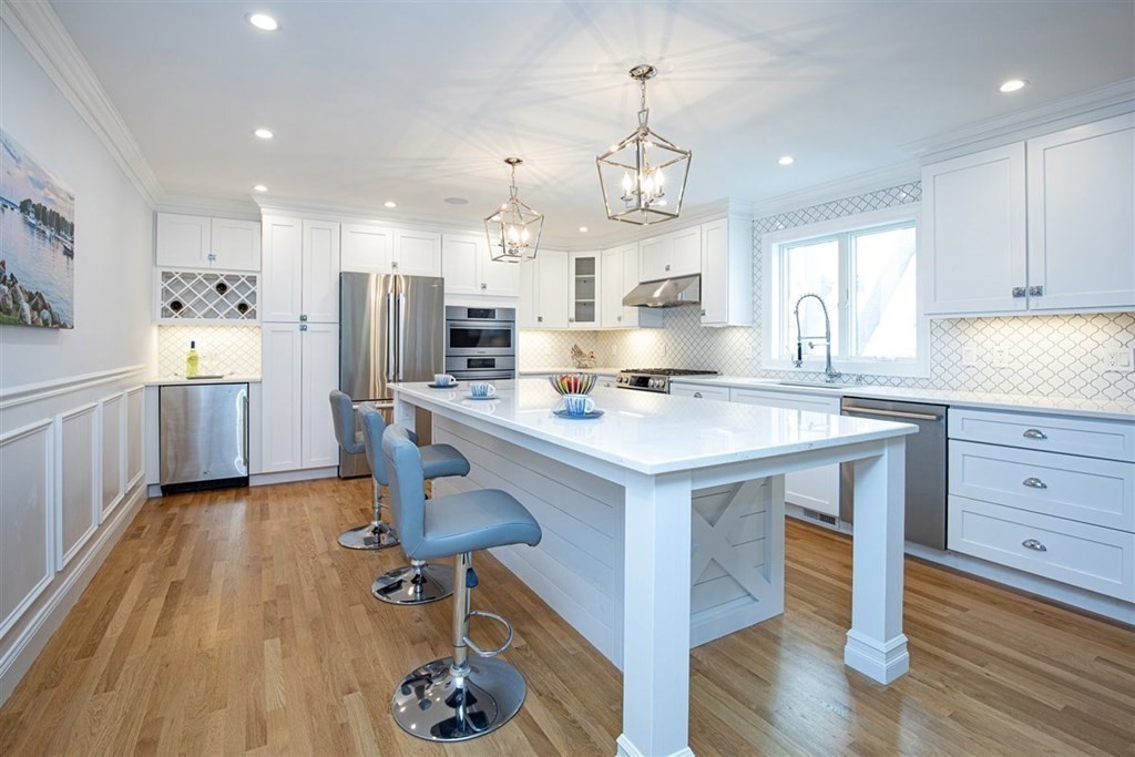 6 Rolleston Road Marblehead, MA 01945 - Photo 3 of 26 a kitchen with refrigerator cabinets and wooden floor