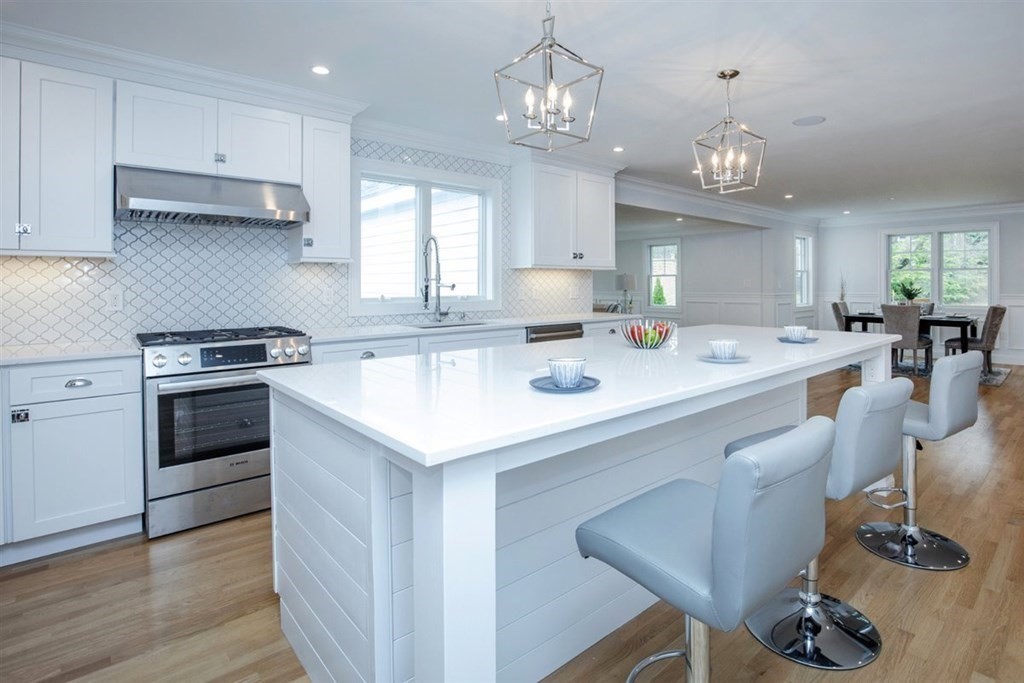 6 Rolleston Road Marblehead, MA 01945 - Photo 4 of 26 a kitchen with a sink stove and cabinets