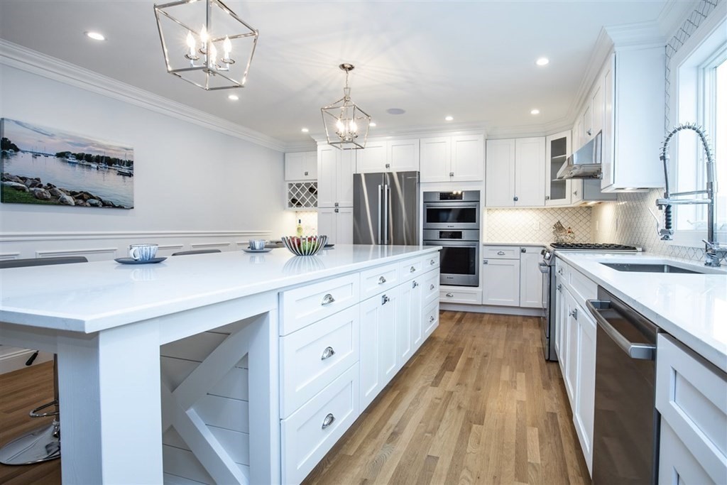 6 Rolleston Road Marblehead, MA 01945 - Photo 5 of 26 a large kitchen with granite countertop a large counter top a sink stainless steel appliances and cabinets
