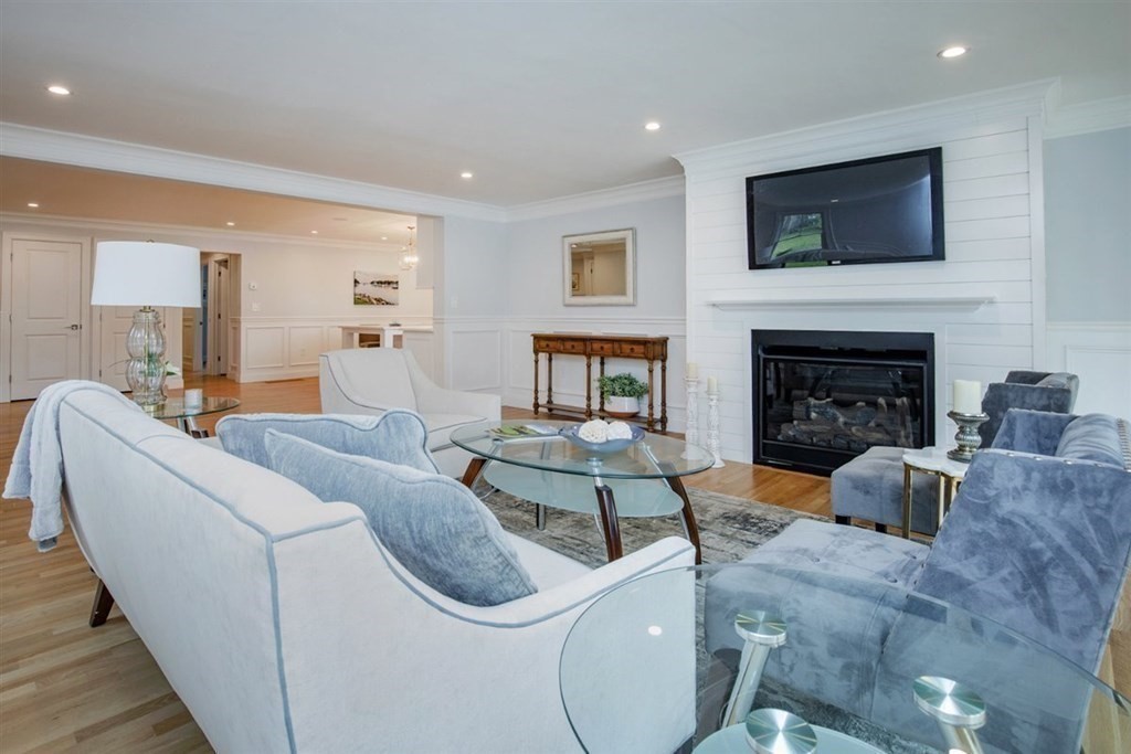 6 Rolleston Road Marblehead, MA 01945 - Photo 8 of 26 a living room with furniture a flat screen tv and a fireplace