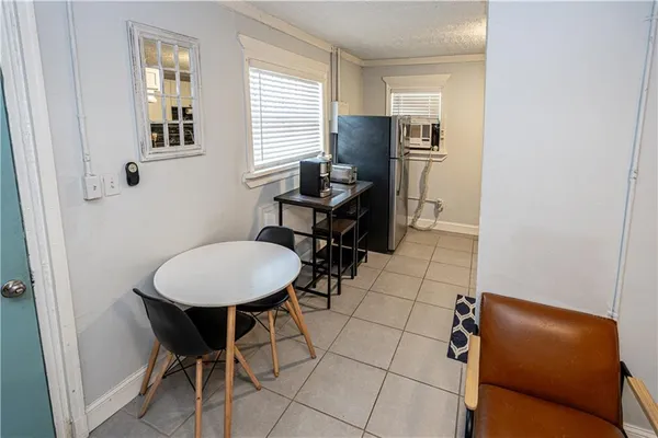 a room with dining table and a window