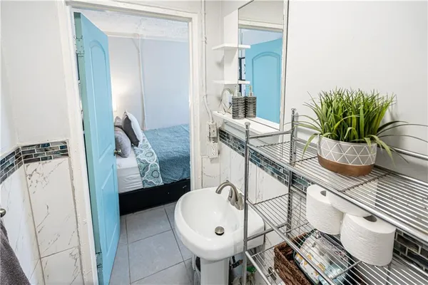 a bathroom with a sink and mirror