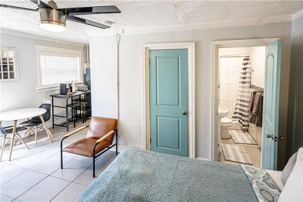 a living room with furniture a rug and a window