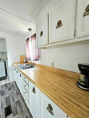a view of kitchen with wooden floor