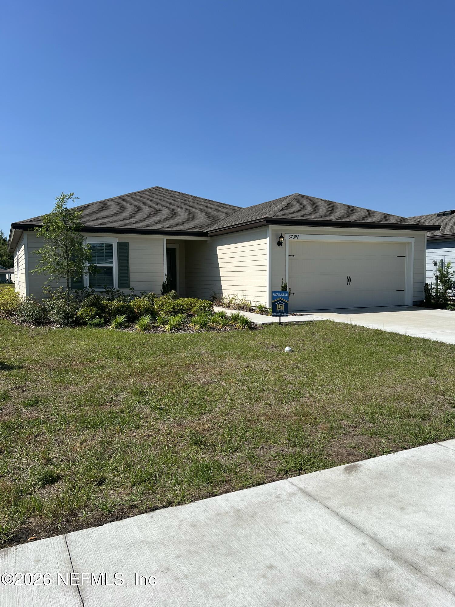 37397 Whisper Way Hilliard, FL 32046 - Photo 1 of 9 a front view of house with yard